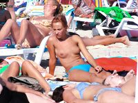 Holding a Paddle Ball Racket Among Beach Umbrellas