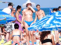Feeling the raw energy of the sun while relaxing in a state of total nudity. 3
