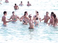 Topless Beach Stand in Patterned Bikini Bottoms by the Sea