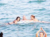 Topless Beach Stand in Patterned Bikini Bottoms by the Sea