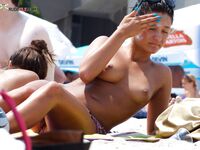 Capturing the essence of a carefree, topless summer at a natural coastline. 2