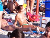 A nice girl with nice boobs on a beach : first time under the sun ?