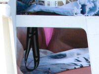 A lady enjoying the calm of a secluded bay in a topless fashion.