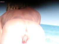 Orange Headband and a Magazine Near the Nude Beach Shoreline