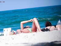 Orange Headband and a Magazine Near the Nude Beach Shoreline