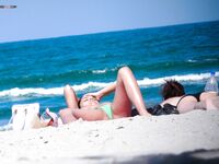Orange Headband and a Magazine Near the Nude Beach Shoreline
