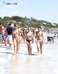 Finding serenity in a private cove, away from the crowds, enjoying the sun topless. 2
