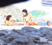 Rocky Coastal Nude Beach with a Tattooed Bather