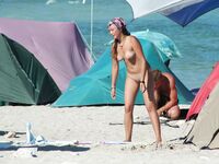 Nude Beach Shoreline with Waves Splashing at the Ankles