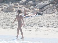 Nude Beach Shoreline with Waves Splashing at the Ankles
