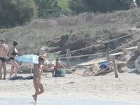 Nude Beach Shoreline with Waves Splashing at the Ankles