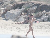 Nude Beach Shoreline with Waves Splashing at the Ankles
