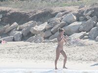 Nude Beach Shoreline with Waves Splashing at the Ankles