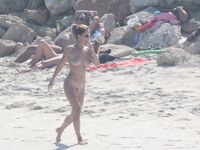 Nude Beach Shoreline with Waves Splashing at the Ankles