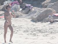Nude Beach Shoreline with Waves Splashing at the Ankles