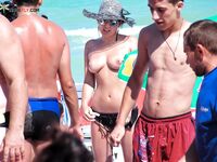 Woven Sun Hat and Mirrored Shades on a Topless Beach