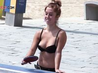 The sensation of the salt air and sun on a bare, topless figure. 4