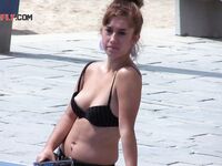 The sensation of the salt air and sun on a bare, topless figure. 4