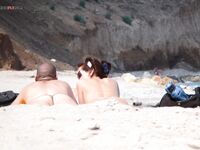 The freedom of a long summer walk on a beach where clothes are not needed.