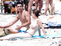 Posing for the lens in a natural, clothing-free coastal environment. 4
