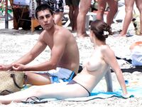 Posing for the lens in a natural, clothing-free coastal environment. 4