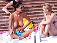 Finding a spot among the dunes to enjoy the sun in a classic naturist way.