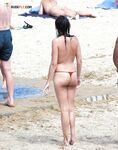 The artistic appeal of bare skin and white sand at a naturist beach. 2