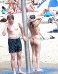 The artistic appeal of bare skin and white sand at a naturist beach. 2