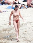 The artistic appeal of bare skin and white sand at a naturist beach. 2