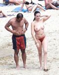 The artistic appeal of bare skin and white sand at a naturist beach. 2