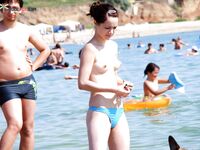 Posing with confidence and grace in a completely natural, nude fashion. 2