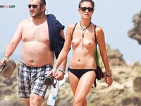 Capturing the radiant glow of a sun-lover at a clothing-free beach.