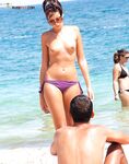 . Capturing the radiant glow of a sun-lover at a clothing-free beach. 2