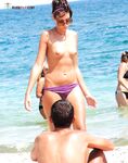 . Capturing the radiant glow of a sun-lover at a clothing-free beach. 2