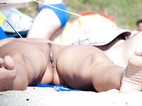 The artistic appeal of a sun-drenched body at a naturist retreat. 2