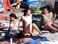 Handwritten White Bottoms and Yellow Ties on Busy Topless Sand