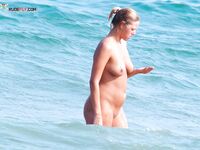 The aesthetic of a sun-drenched body at a quiet, open-minded seaside location. 2