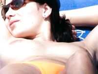 Posing Nude Outdoors with Red-Painted Fingernails