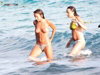 Walking the Shoreline Topless in Black Bikini Bottoms