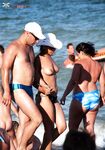 The sensation of the salt air and sun on a bare, topless figure. 5