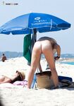 Straw Hat, DSLR, and a Sunlit Walk Across the Nude Beach