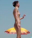 A Souvenir Photo Moment on the Open Nude Beach Sand