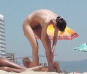 A Souvenir Photo Moment on the Open Nude Beach Sand