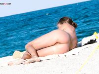 Capturing the independent spirit of a woman who loves the freedom of the nude beach. 2