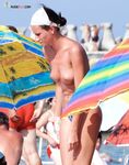 Patterned Blue Bottoms and a Palm-Print Parasol on the Sunny Shore