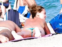 Turquoise Thong and a Pink Towel at the Calm Water's Edge