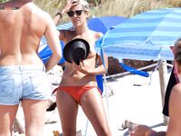 Walking the Shoreline Among Nude Beach Visitors