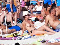 Out of the Shallow Surf on a Brazilian Nudist Beach Shore