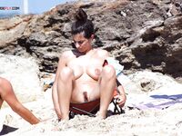 Total Ease on a Folding Chair at a Rocky Nude Beach