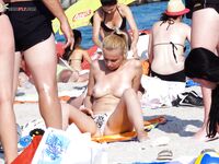 Topless on the Sand, Watching the Sea on a Sunny Coast